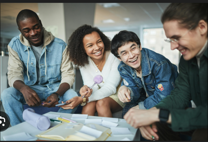They show a group of students working individually and a group of students working together. The students are a mixture of genders and nationalities. There are five students in the first picture and four students in the second picture.